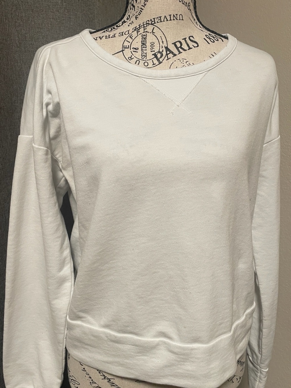 Nike White Dri-FIT Short Sleeve Tee with open back design.